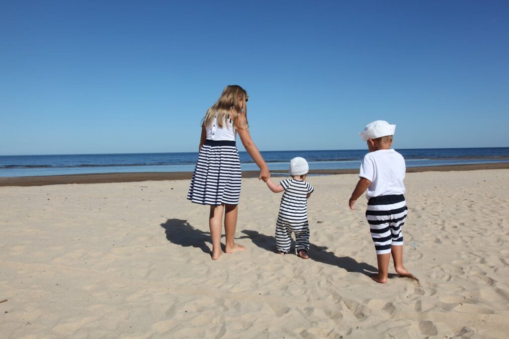 a family enjoying a beach at a port of call of a family cruise in the caribbean