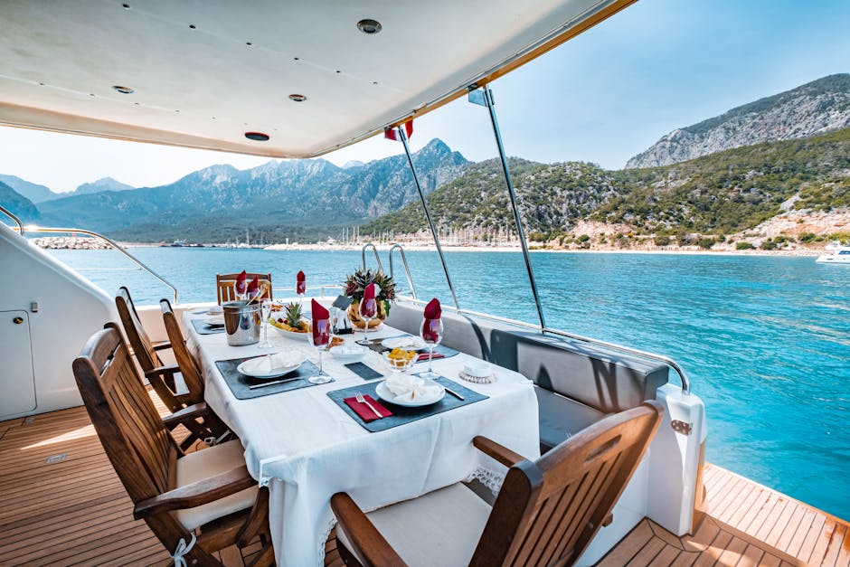 Elegant dining setup on a yacht overlooking Antalya's scenic coast in Türkiye.